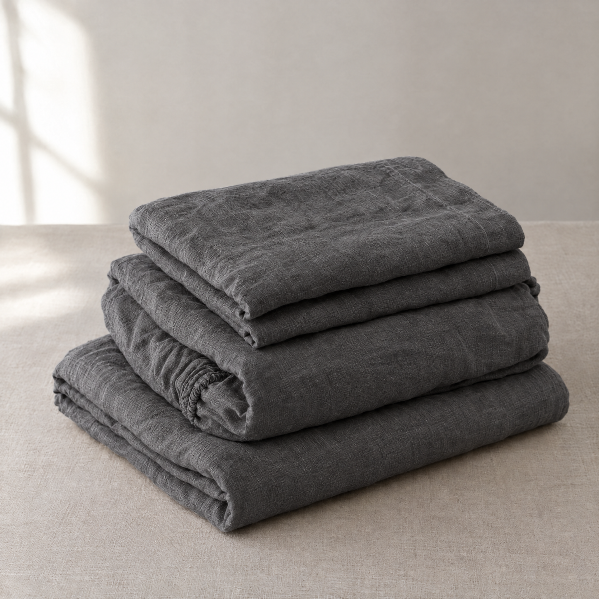 Stonewashed linen sheet set in Charcoal, folded